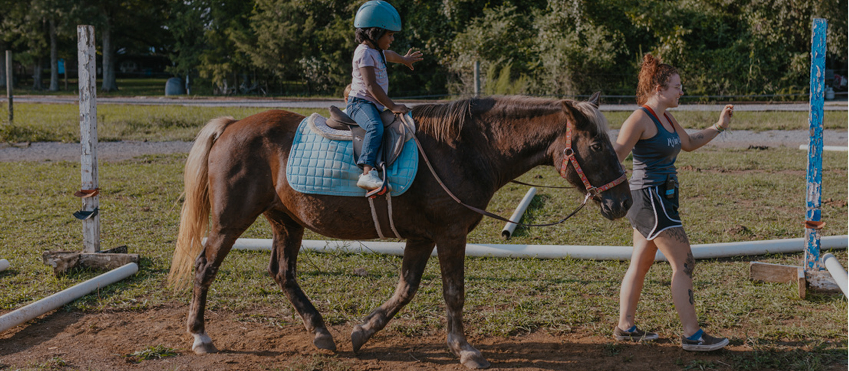 Child On Horse Led by Volunteer